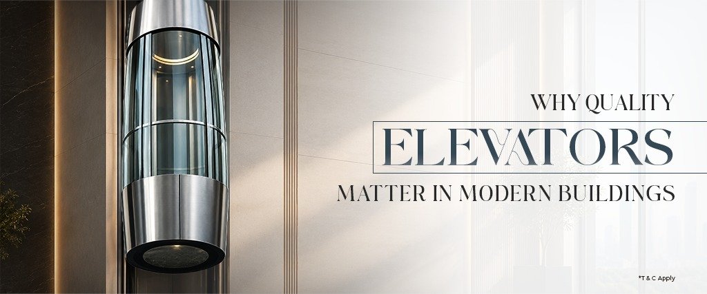 Modern cylindrical glass elevator with stainless steel finishes in an elegant building interior, highlighting how home elevators & lifts enhance accessibility, safety, comfort, and contemporary design.
